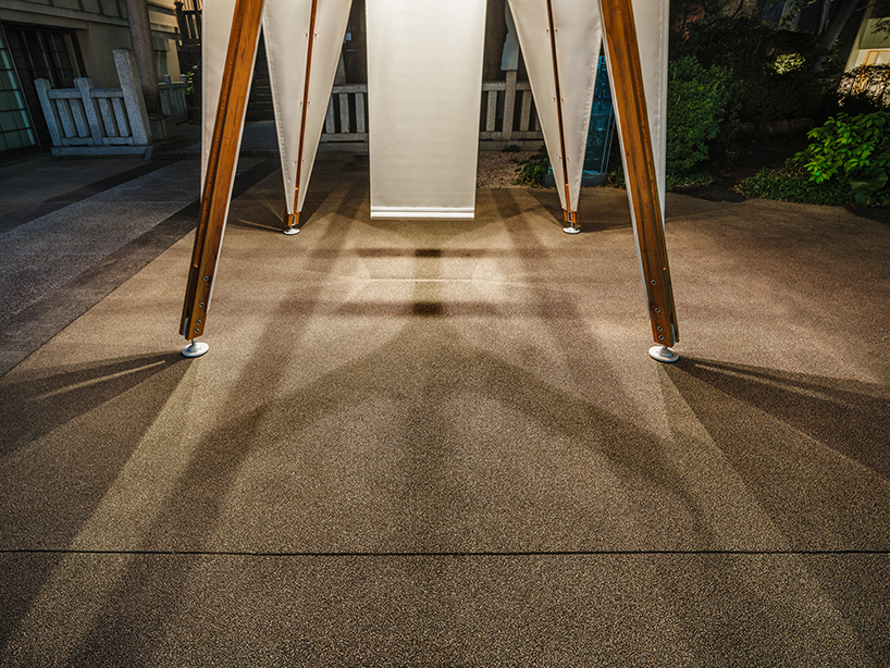 rhythmic layering of wood and fabric weaves sail-inspired installation by cheng tsung feng