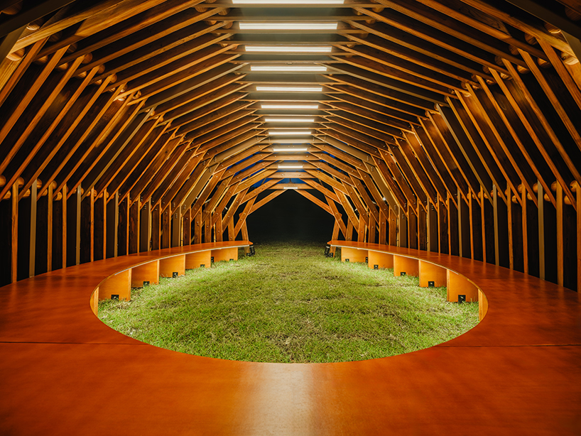 interlocking bamboo and cedar frames shape wild boar nest installation by cheng tsung feng