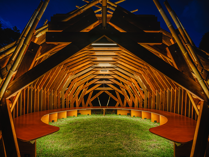 interlocking bamboo and cedar frames shape wild boar nest installation by cheng tsung feng