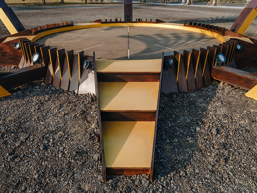 bent wooden beams fan like illuminating petals in cheng tsung feng&rsquo;s installation in taiwan