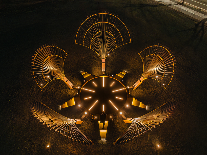 bent wooden beams fan like illuminating petals in cheng tsung feng&rsquo;s installation in taiwan