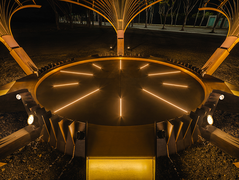 bent wooden beams fan like illuminating petals in cheng tsung feng&rsquo;s installation in taiwan
