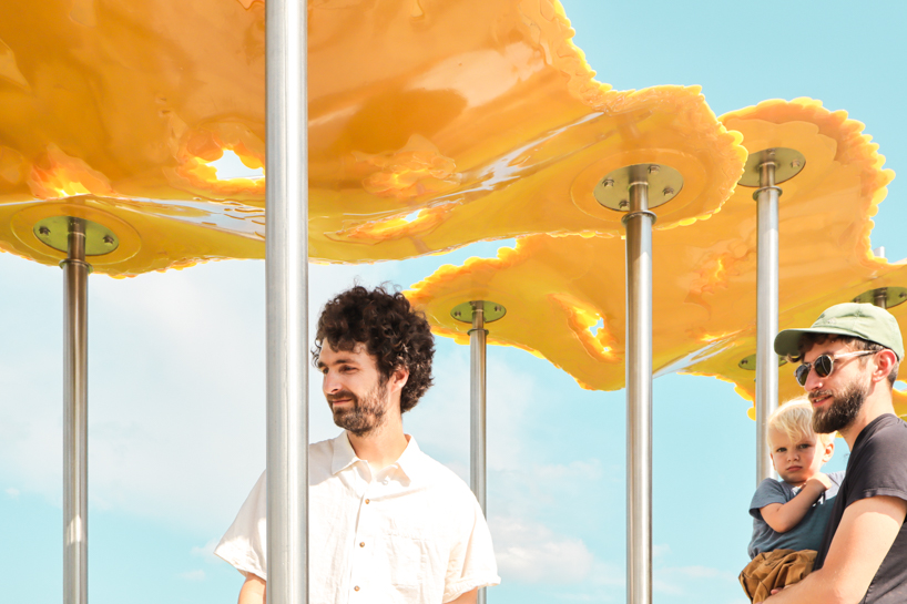 algae-based bio-resin puddle pavilion by i/thee hovers above mud creek in iowa