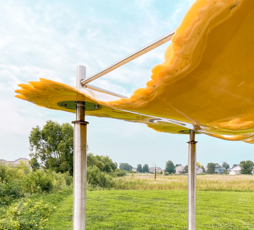 algae-based bio-resin puddle pavilion by i/thee hovers above mud creek in iowa