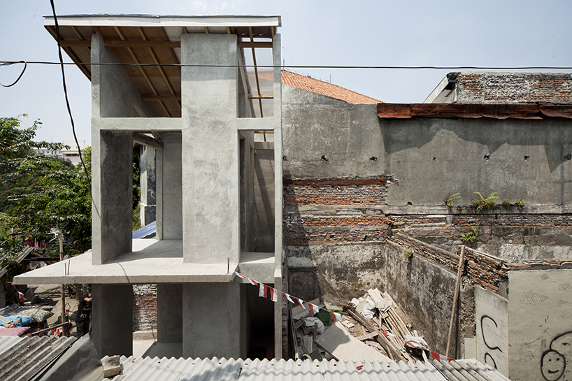 a 60cm void brings natural light and ventilation to an informal settlement in jakarta designboom