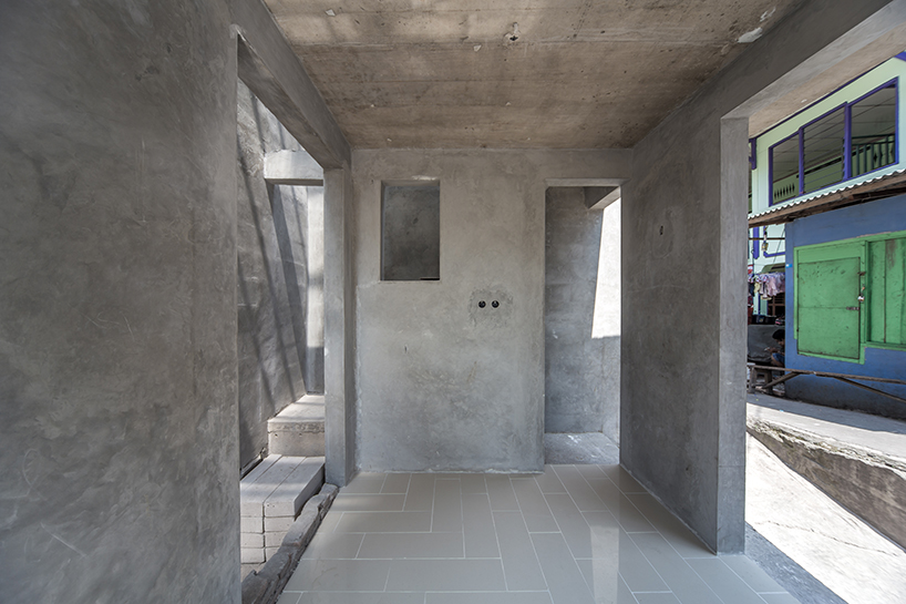 a 60cm void brings natural light and ventilation to an informal settlement in jakarta designboom