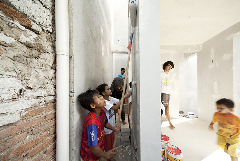 a 60cm void brings natural light and ventilation to an informal settlement in jakarta designboom