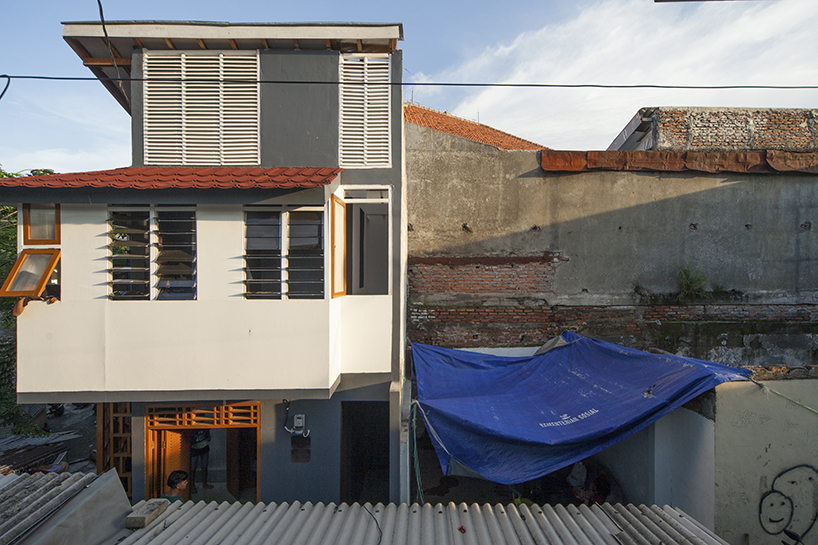 a 60cm void brings natural light and ventilation to an informal settlement in jakarta designboom