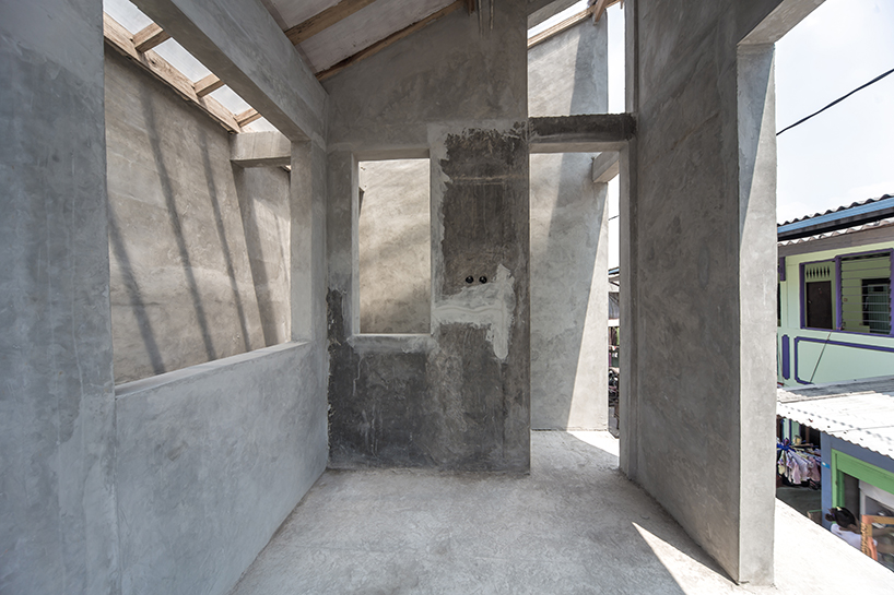 a 60cm void brings natural light and ventilation to an informal settlement in jakarta designboom