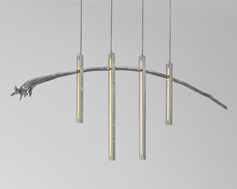 batten and kamp combines textured cast aluminum with rough-cut marble in furniture series
