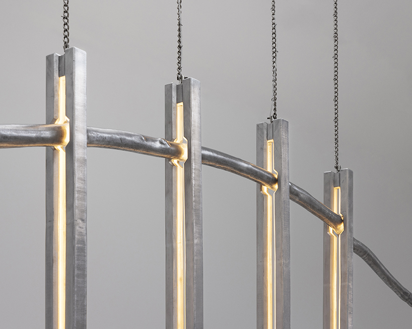 batten and kamp combines textured cast aluminum with rough-cut marble in furniture series