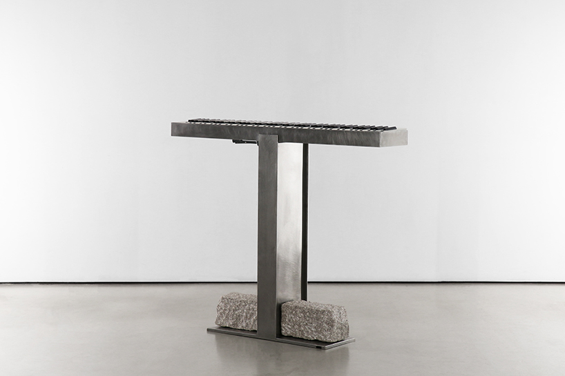 steel and stone piano transforms from electronic instrument to sculptural monolith