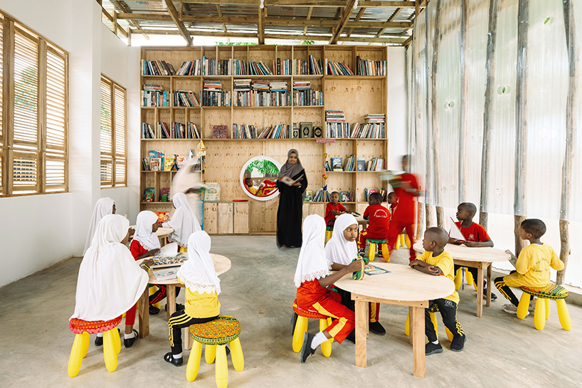 perforated corrugated panels regulate light and ventilation at library in tanzania