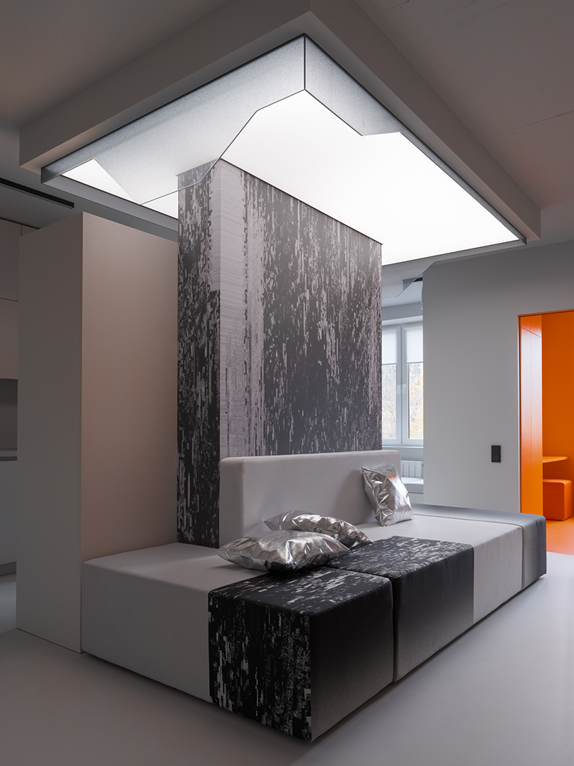 glitch art and vibrant accents enliven and distort UR bureau’s grayscale apartment