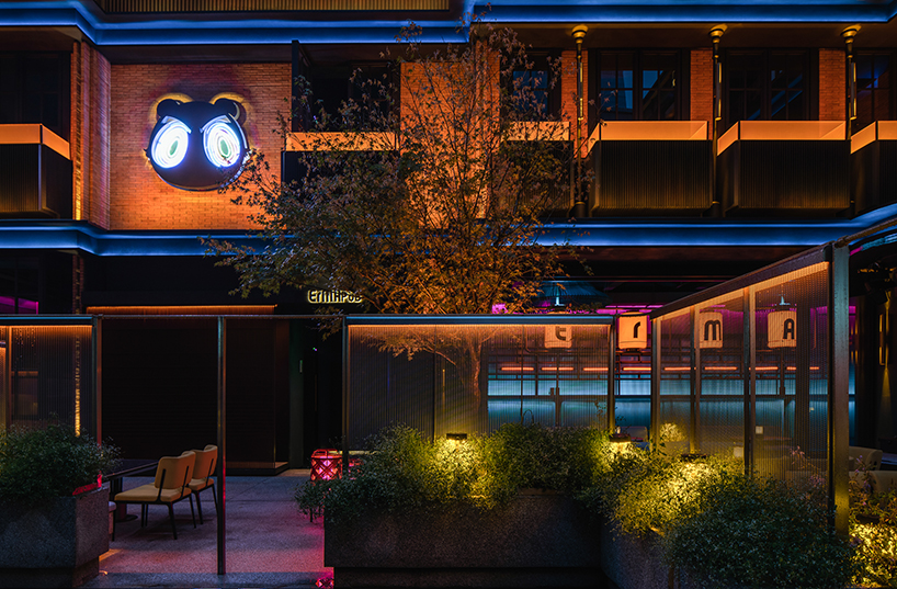 geometrical lines + pops of color create a tipsy night within erma pub in china 