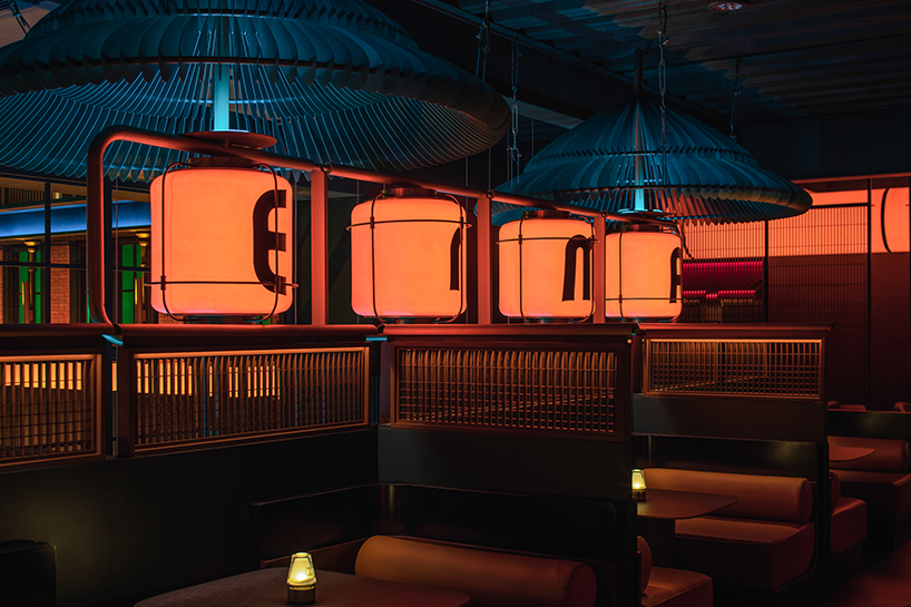geometrical lines + pops of color create a tipsy night within erma pub in china 