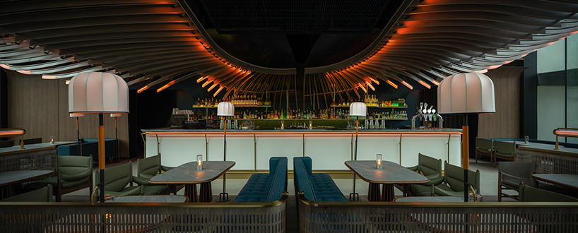 feathered light installation infuses restaurant in china with warm glow