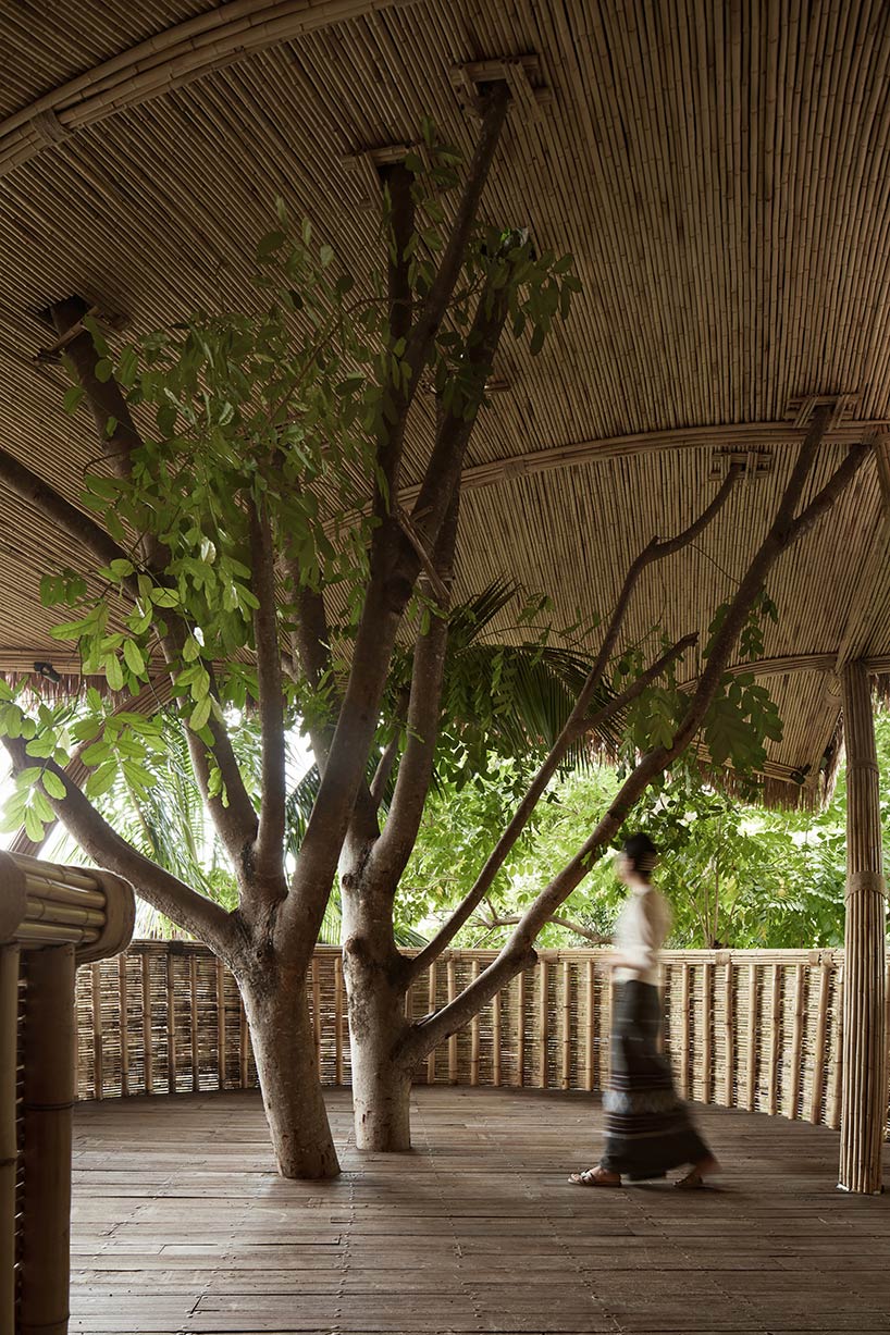 weaved bamboo wraps the floating promenades of spa and restaurant in china