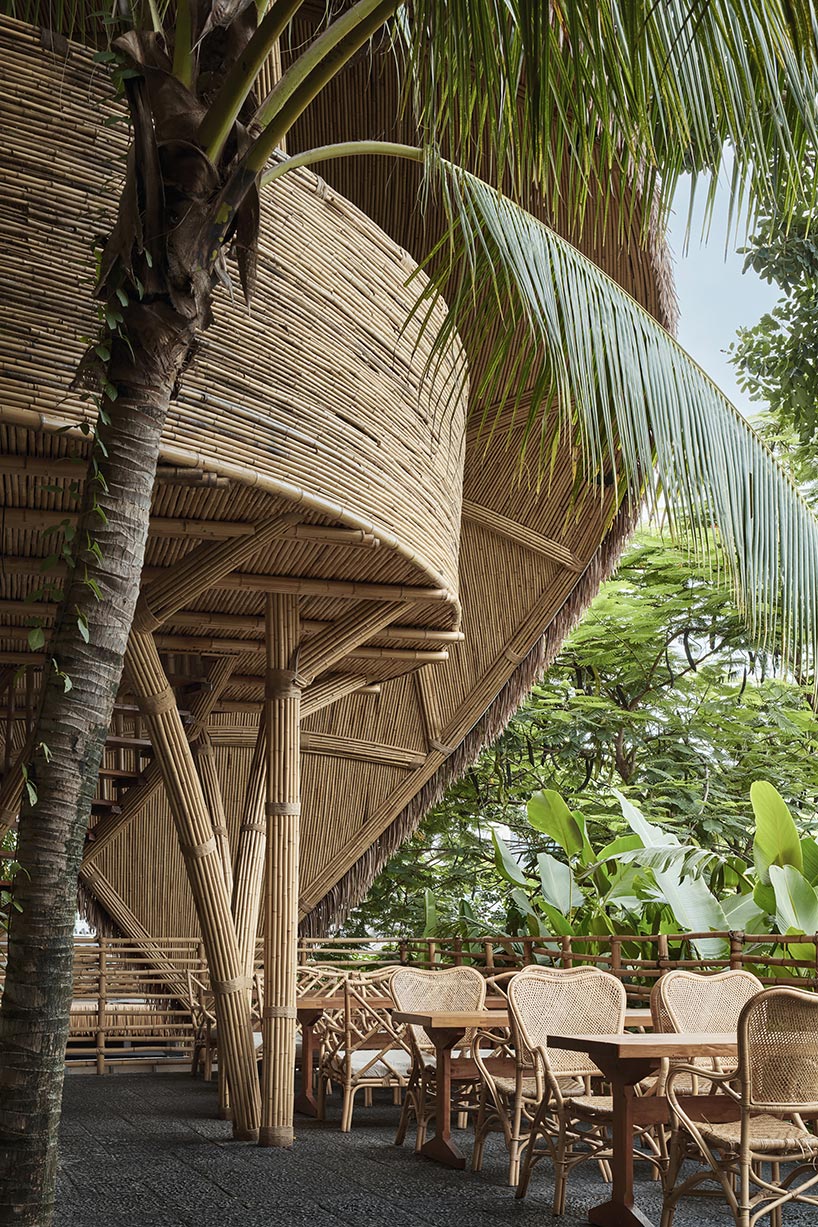 weaved bamboo wraps the floating promenades of spa and restaurant in china