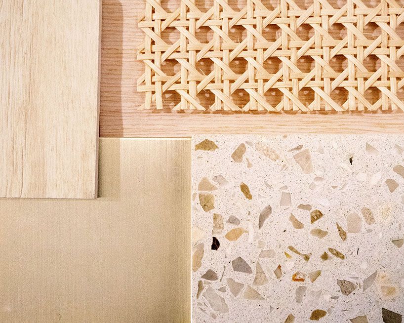 absence from island completes apartment interior in hong kong with rattan, wood + terrazzo