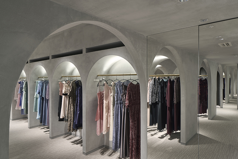 tsutsumi and associates forms labyrinth store in japan with romanesque concrete arches