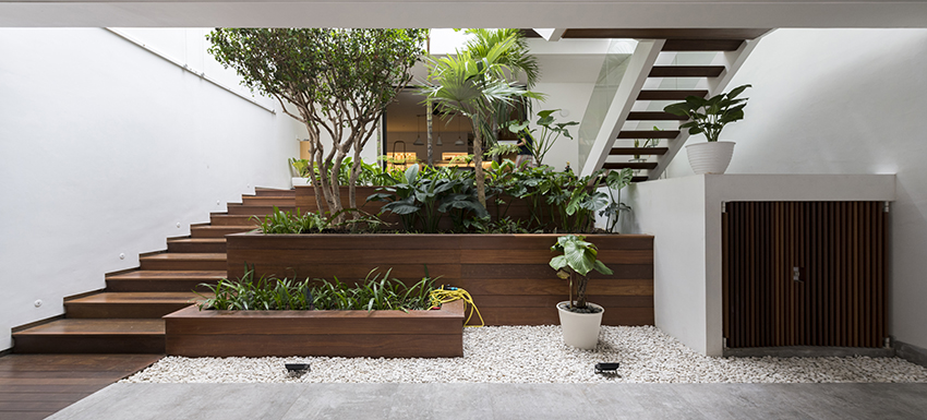 open air vertical circulation in lush tropical courtyard in residential by w office 6