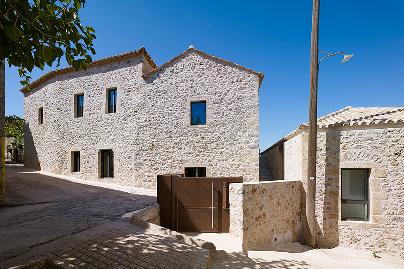 1850s greek olive mill rebirthed with cor ten steel creating the rusted mill house modern holiday villa 1