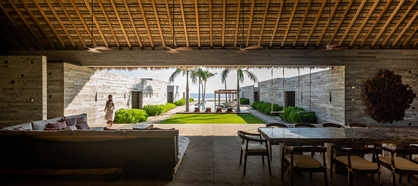 dried palm tree leaves + local parota wood build roof for vacation house in mexico