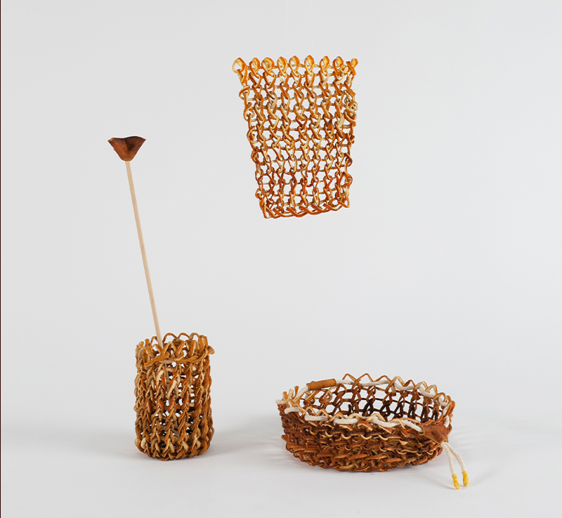 yuli meroz cuts, folds and knits orange peels to create intricate craft creations