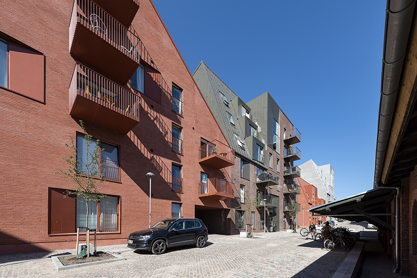 CEBRA designs a 'cozy cobbled streetscape' for aarhus apartments designboom