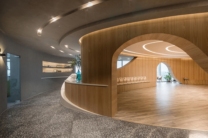 behive architects designs an oval salon for meditation in an office building 4