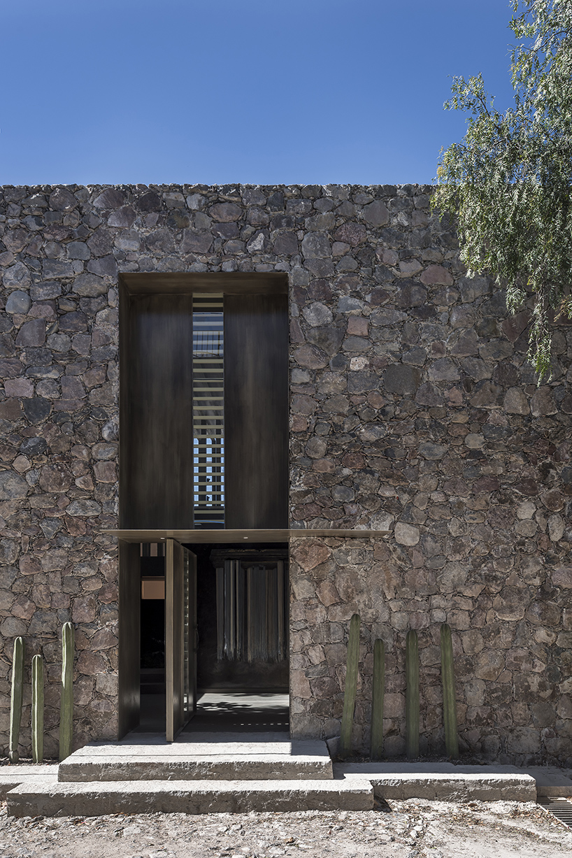 sober elements + natural materials decorate restaurant by faci leboreiro 