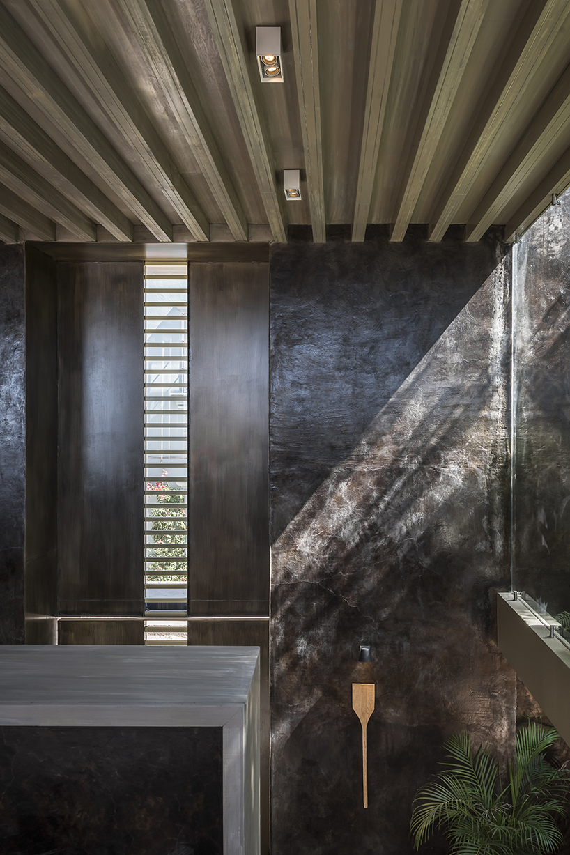 sober elements + natural materials decorate restaurant by faci leboreiro 