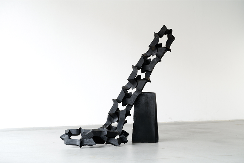 takuto ohta slices into japanese cedar to create sculptural tension for asymptotic wood series