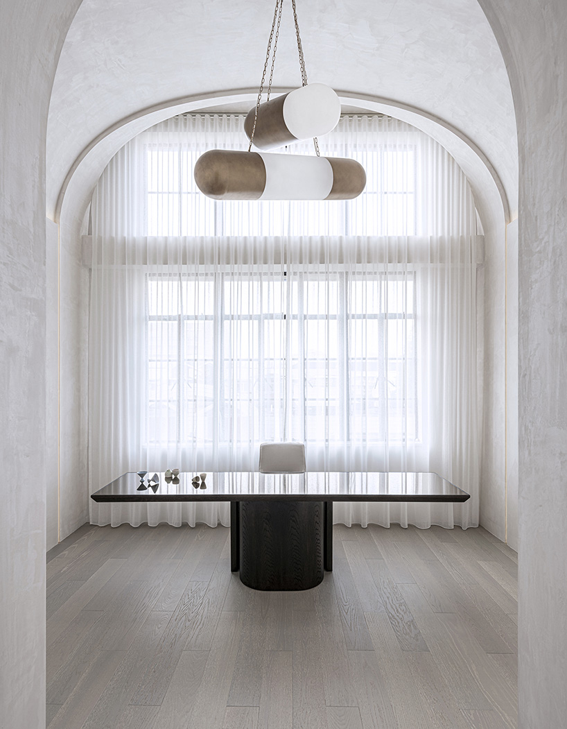 EVD designs own office space in shanghai using a repeating arched motif designboom
