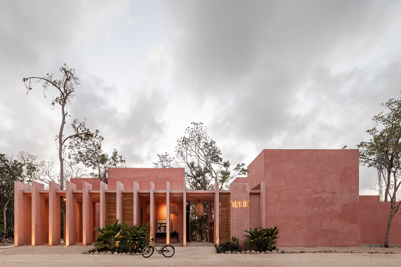 coyote arquitectura weaves greenery through red complex in tulum