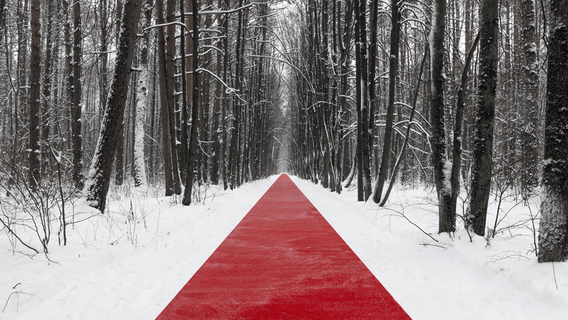 gregory orekhov rolls out 250-meter-long red carpet across snowy russian landscape