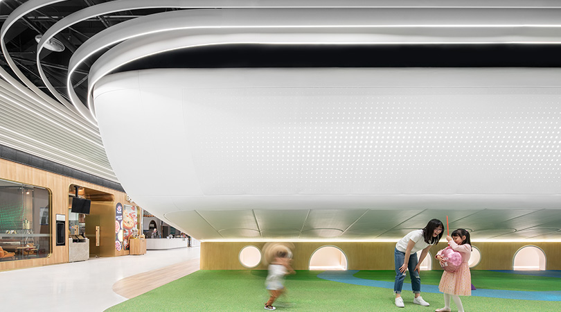 DUTS design installs infinite 'mobius ring' in beijing shopping mall with large-scale kids town