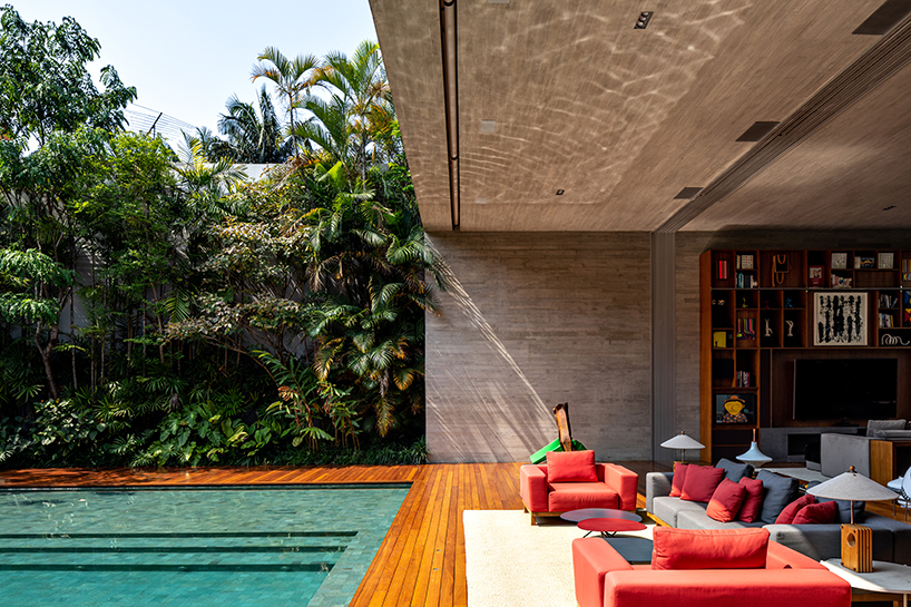 an ensemble of imposing blocks organized around a pool forms ibsen house in brazil