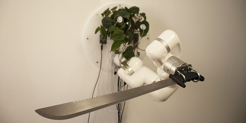 living plant controls a machete through an industrial robot arm