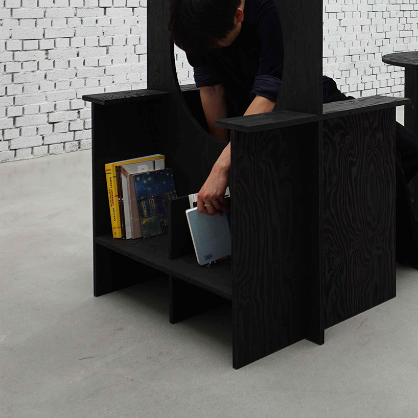 woocheol shin pierces dark wood furniture with circular openings for porthole series