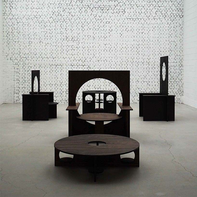 woocheol shin pierces dark wood furniture with circular openings for porthole series