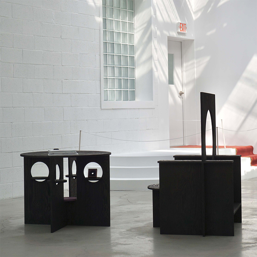 woocheol shin pierces dark wood furniture with circular openings for porthole series