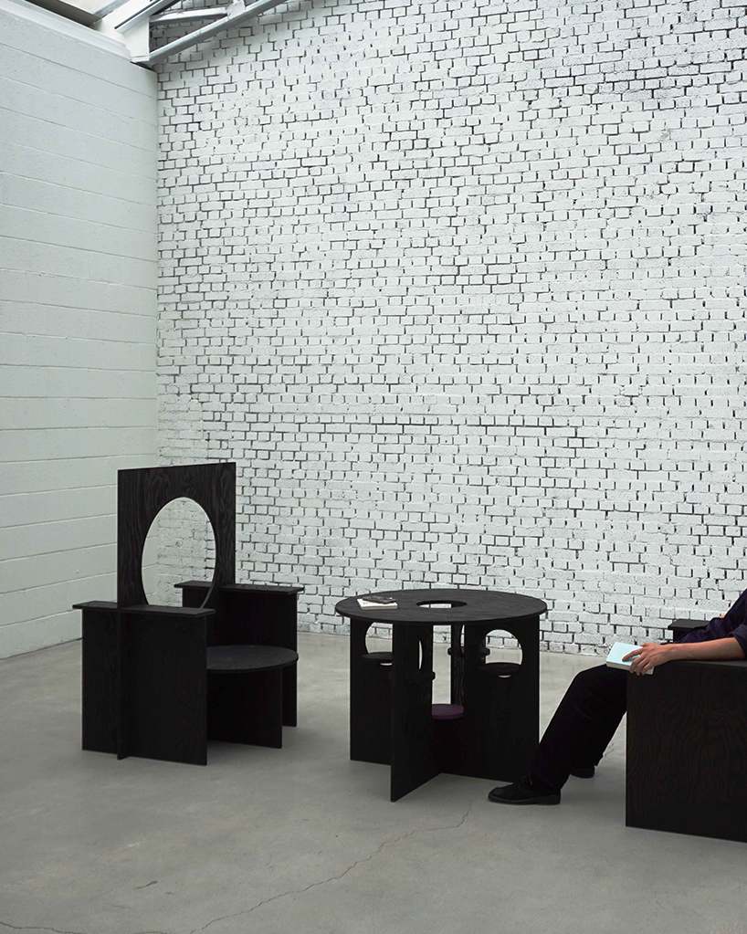 woocheol shin pierces dark wood furniture with circular openings for porthole series