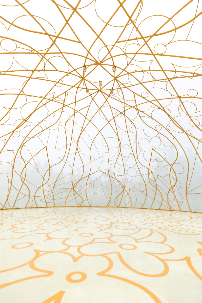 translucent illuminating dome bears bronze lattice of flower motifs in shanghai