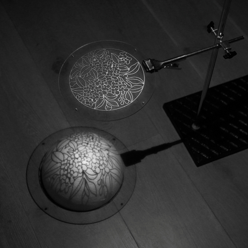 translucent illuminating dome bears bronze lattice of flower motifs in shanghai