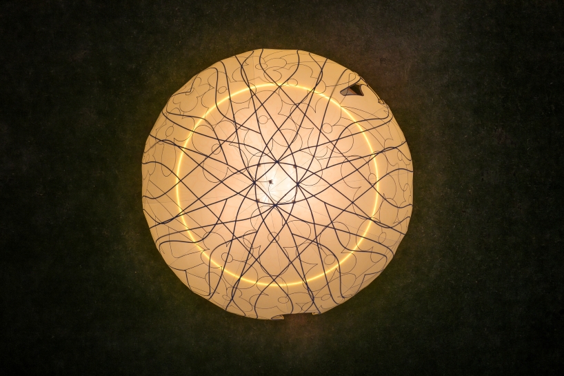 translucent illuminating dome bears bronze lattice of flower motifs in shanghai
