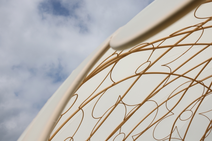 translucent illuminating dome bears bronze lattice of flower motifs in shanghai