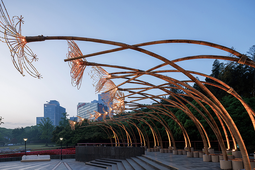 woven bamboo canopy forms floral field bending over sunken urban plaza in shanghai - 10