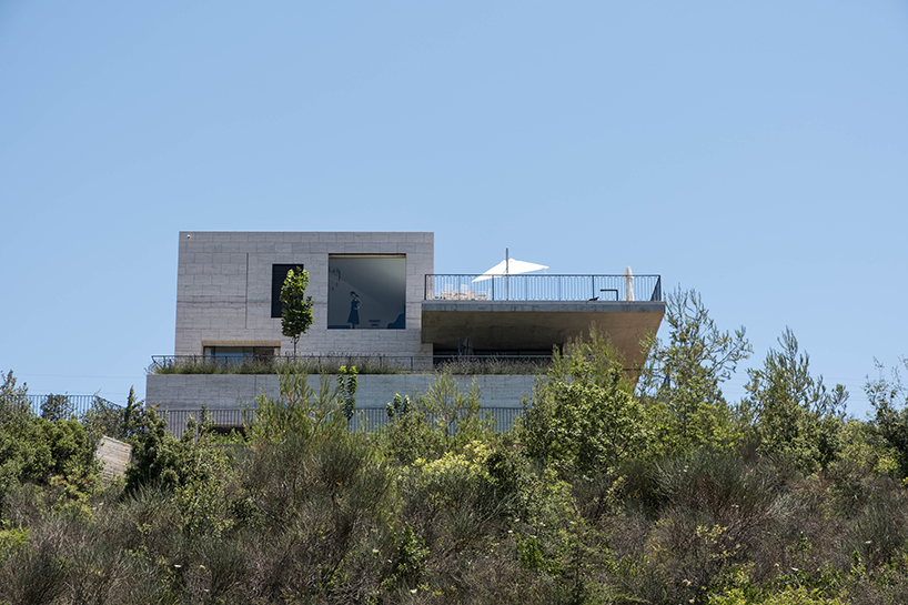 rab architects designs a house with sliding travertine walls in lebanon designboom